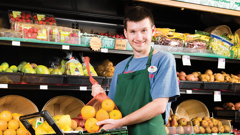 LifeScape client working at a grocery store LifeScape client working at a grocery store